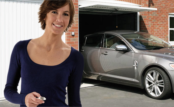 A woman standing in front of her garage